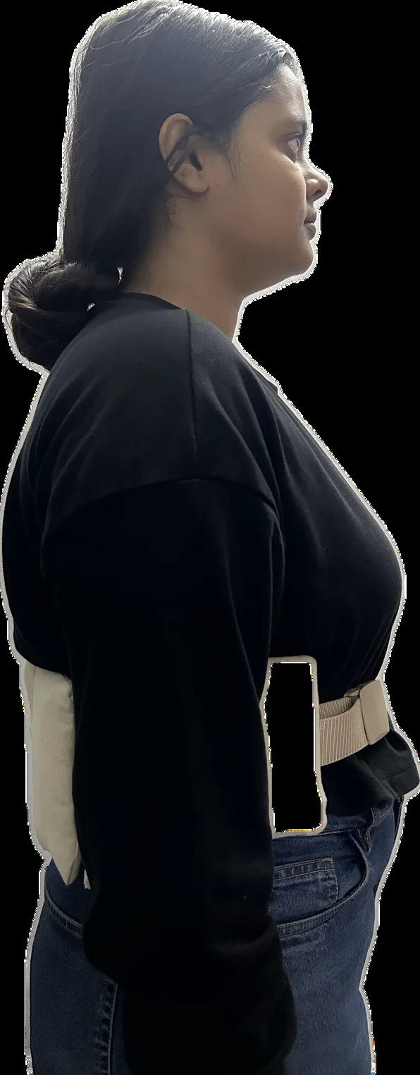 A person wearing the prototype belt, side view