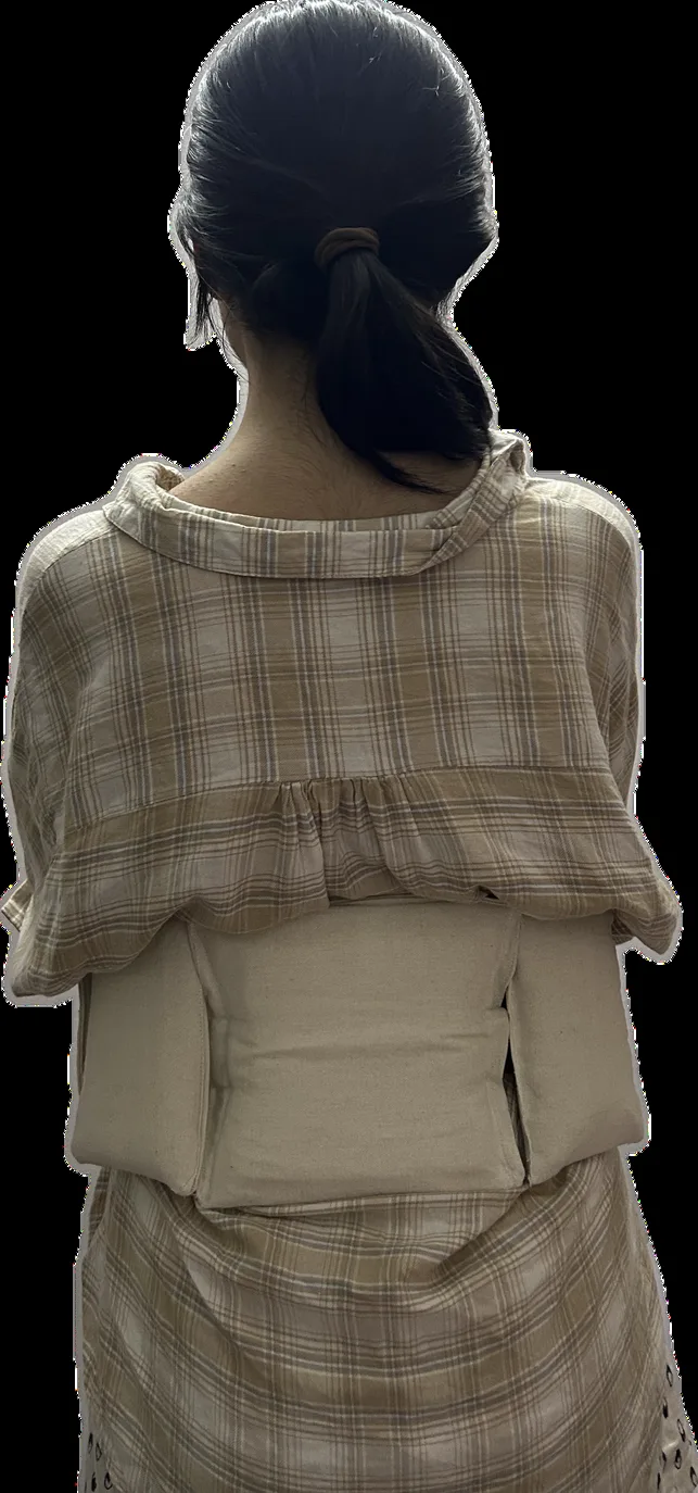 A person wearing the prototype belt, back view
