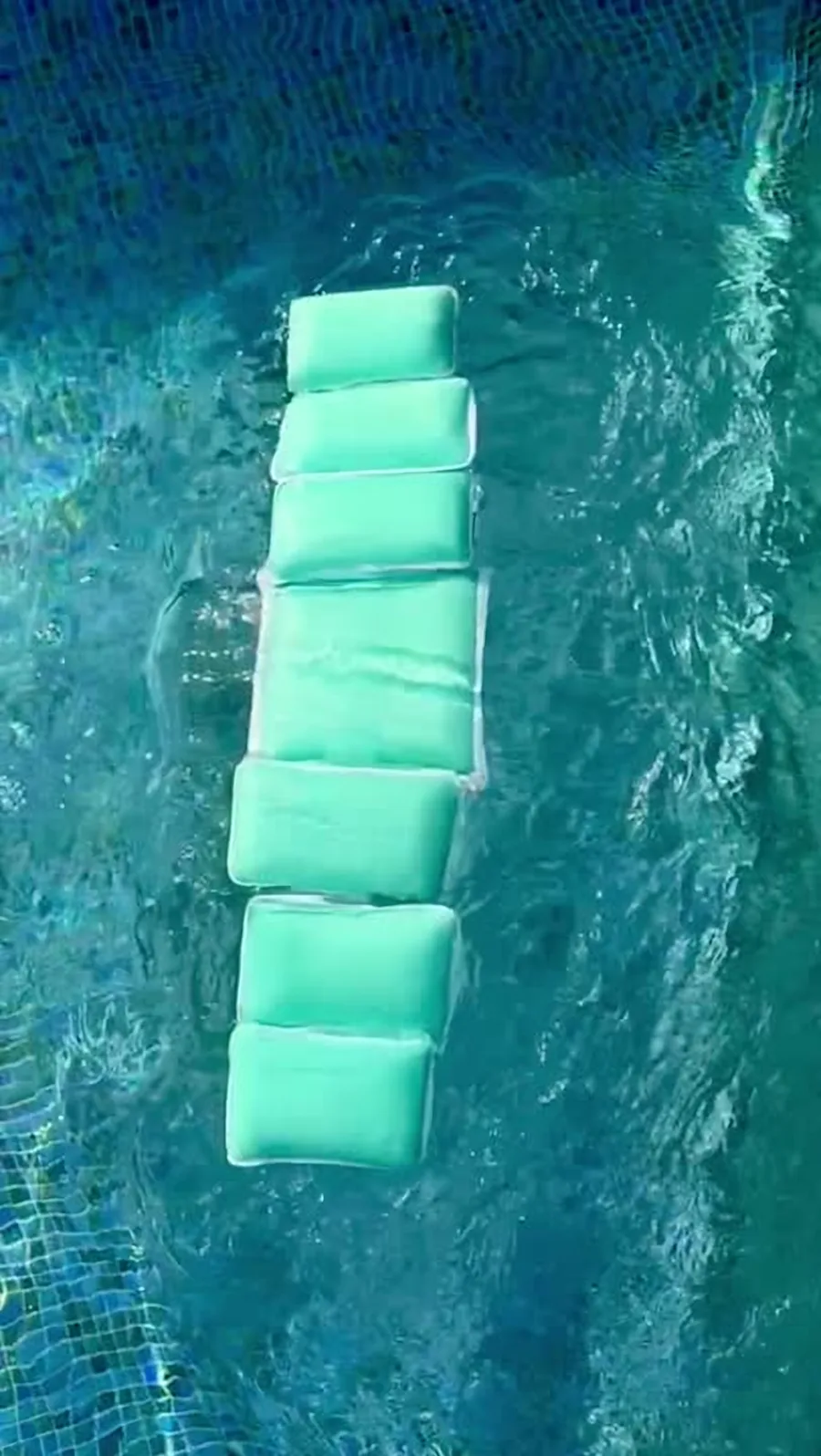 The finished belt floating flat on a pool
