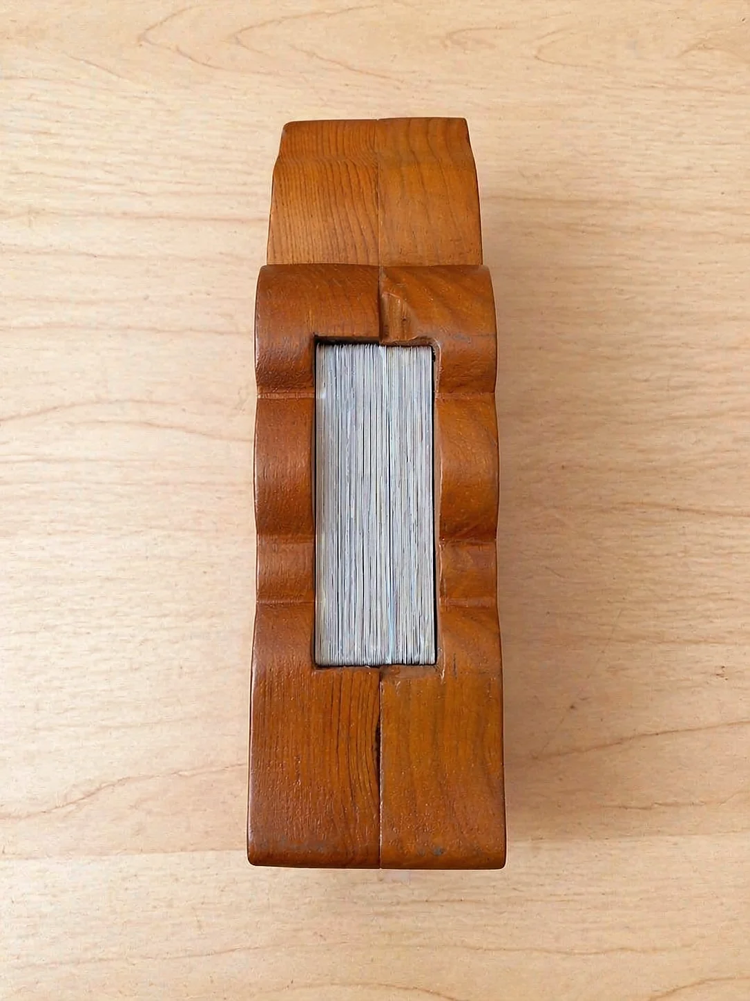 Ellie seen from above, the small flipbook tucked into a slot in the back