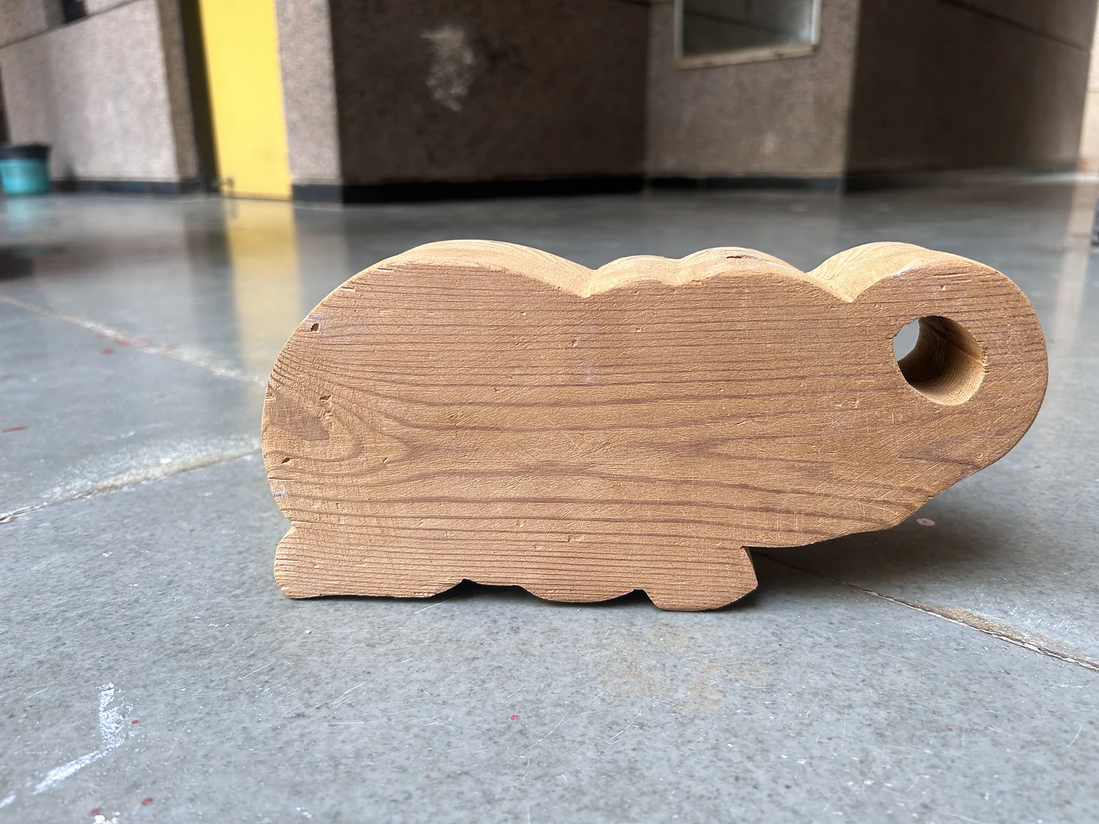 Ellie glued and sanded, in raw pine, on a stone floor