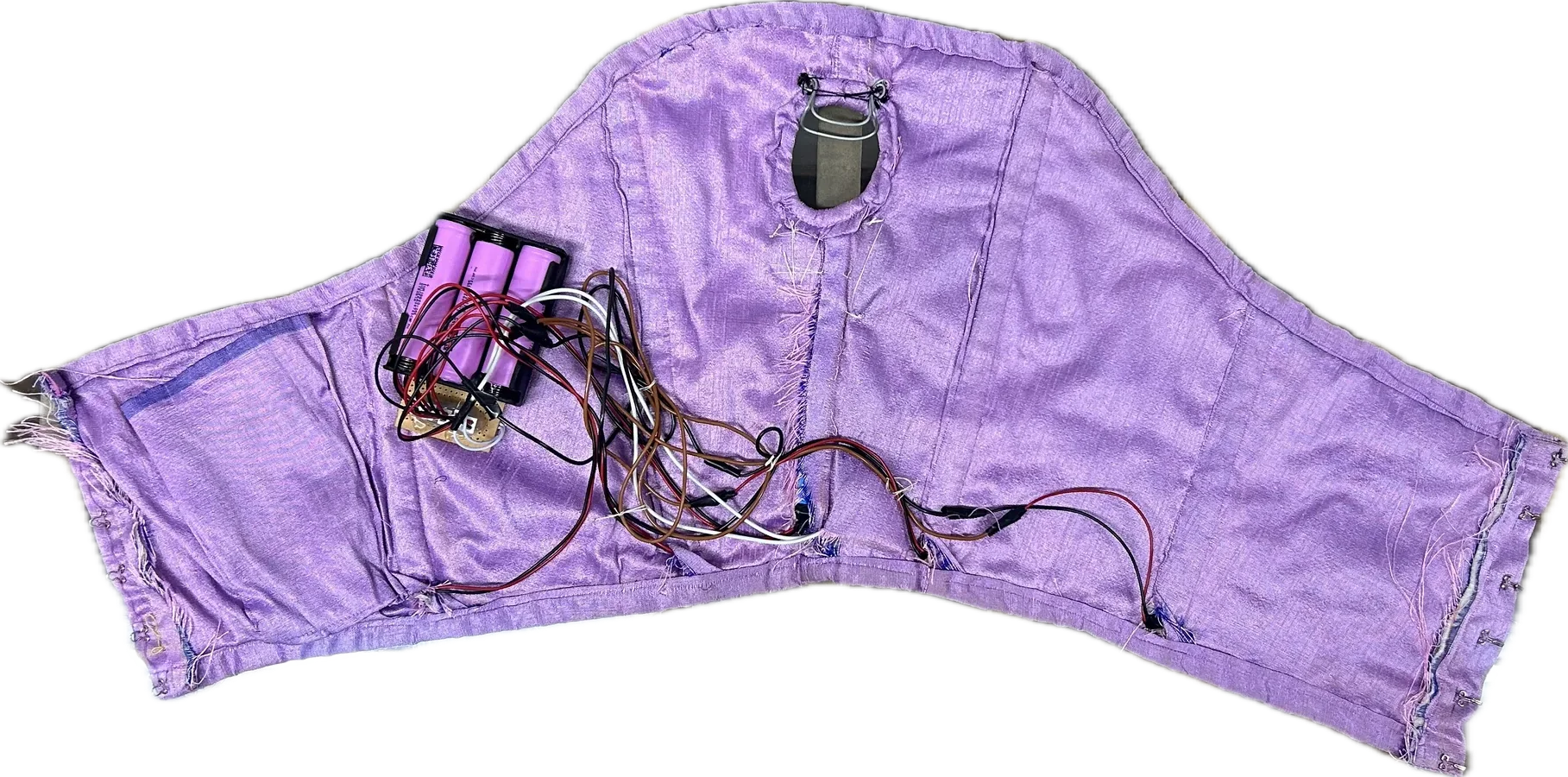 Inside the corset: wiring and a battery pack sewn into the lining