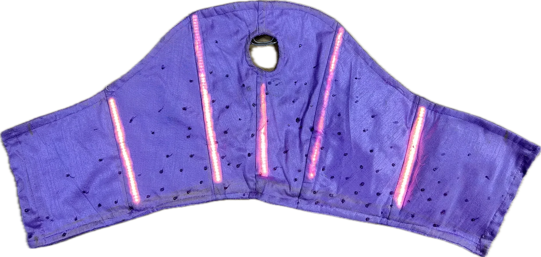 The corset lit from inside by pink LED strips