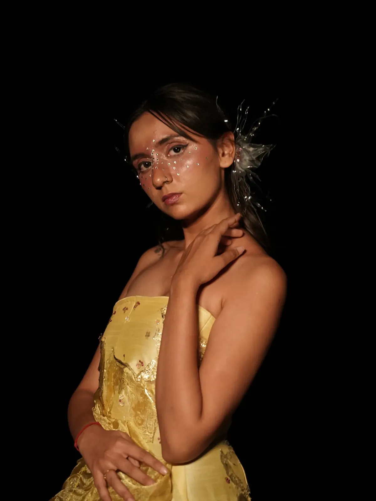Portrait in yellow with crystals on the face