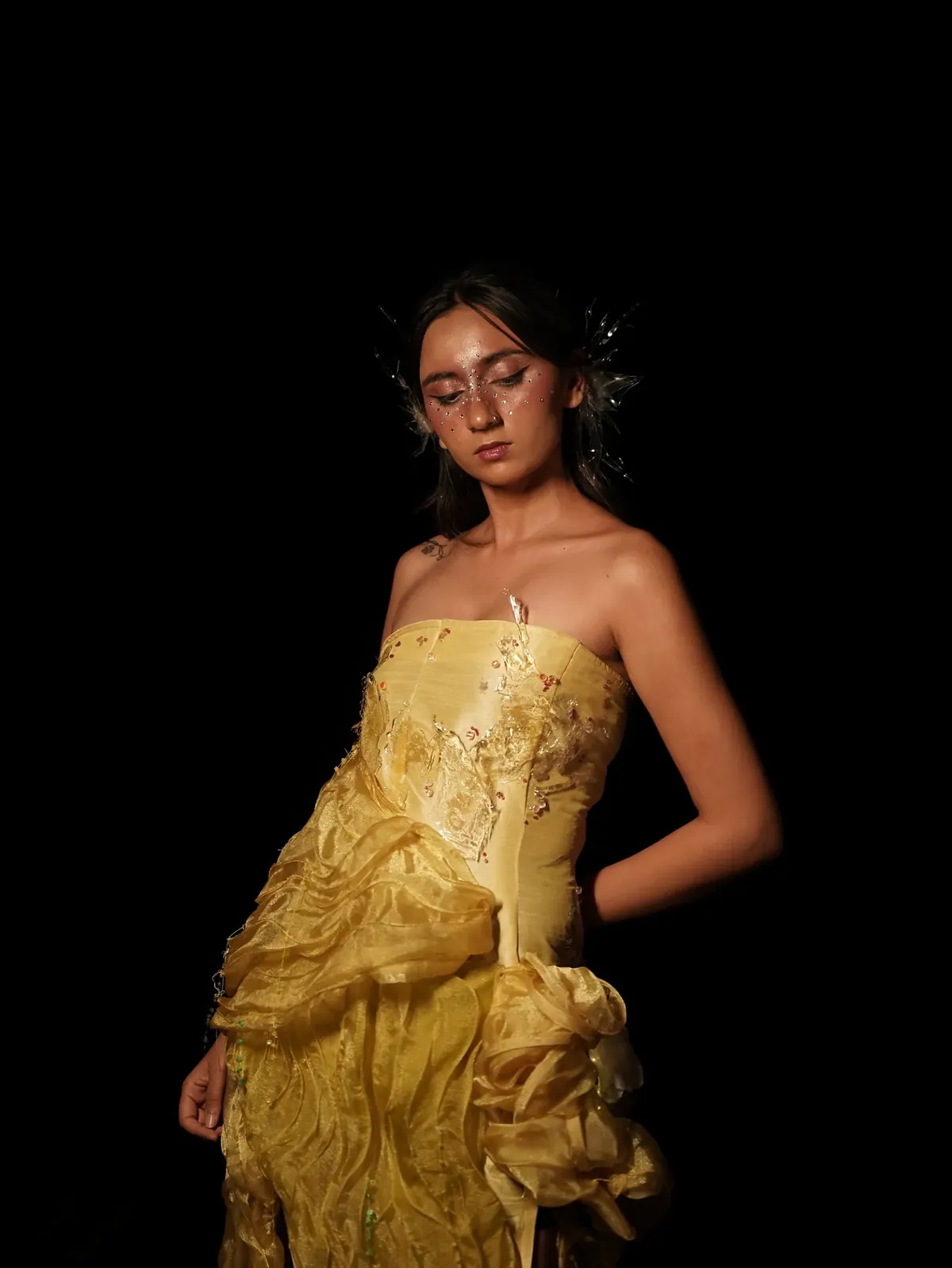 The yellow gown, eyes closed